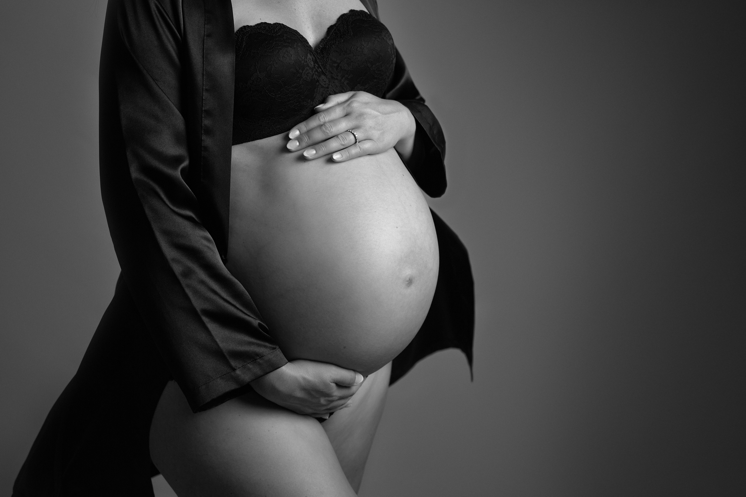 Close up photo of a pregnant bump at a maternity photoshoot in Cheshire