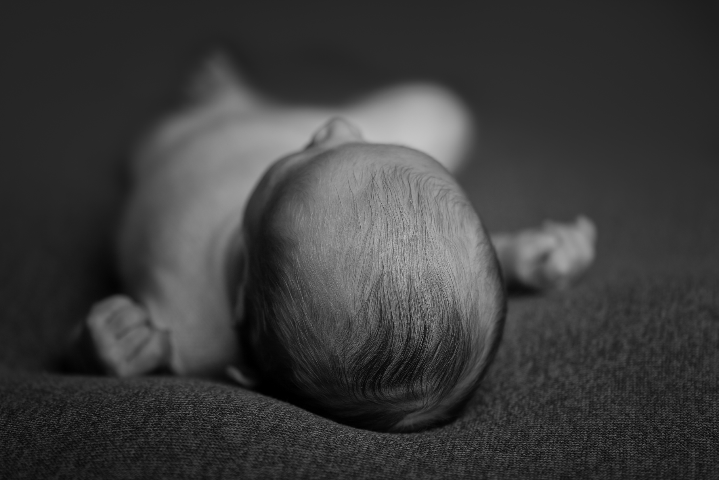 Macro shot of the top of a baby's head by Cheshire newborn photographer in Sandbach