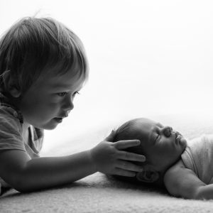 Sibling shot of newborn and his brother by Cheshire newborn photographer in Sandbach