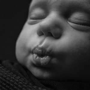 Newborn baby pout in black and white by Cheshire newborn photographer in Sandbach